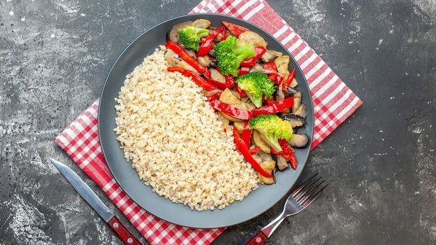 Warm evening plate with grains and vegetables on a calm table setting